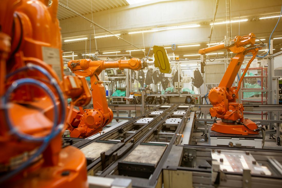 Encoders by Function Application (10) assembly line robots working in factory.